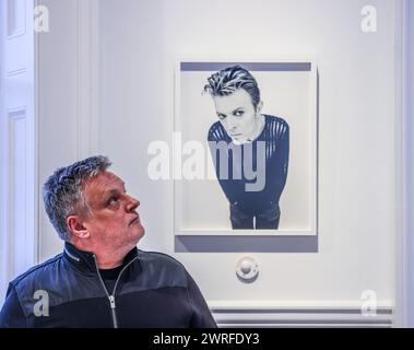 Cromwell Place, London, UK. 12th Mar, 2024. Rankin (pictured) Next to David Bowie No Different From Anyone Else? Dazed & Confused, Issue 15, 1995 Resin Lambda.Through a carefully curated selection of portraits, the latest TIN MAN ART exhibition, Sound Off - at Cromwell Place from 12-24 March 2024 - showcases Rankin ́s ability to create images that came to define the zeitgeist, as well exploring the personalities behind each musician's persona.Paul Quezada-Neiman/Alamy Live News Credit: Paul Quezada-Neiman/Alamy Live News Stock Photo