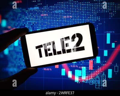 Konskie, Poland - March 11, 2024: Tele2 company logo displayed on mobile phone Stock Photo