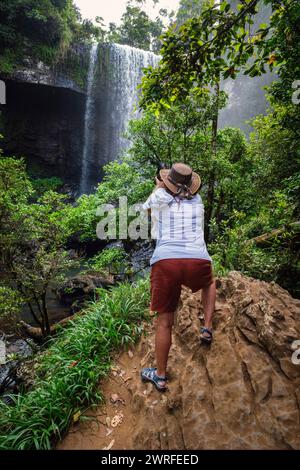 A tourist photographing Zillie Falls, Atherton Tablelands, Queensland, Australia Stock Photo