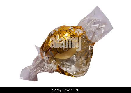 Lindt Lindor white chocolate opened to show contents isolated on white background Stock Photo