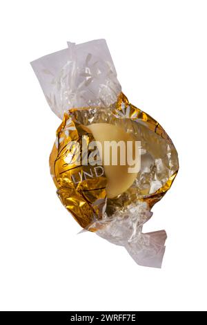 Lindt Lindor white chocolate opened to show contents isolated on white background Stock Photo