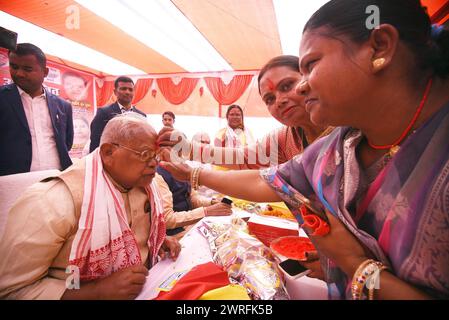 Patna, India. 12th Mar, 2024. PATNA, INDIA - MARCH 12: HAM party founder Jitanram Manjhi being coloured by party women members during Holi Milan Samaroh at his residence on March 12, 2024 in Patna, India. (Photo by Santosh Kumar/Hindustan Times/Sipa USA) Credit: Sipa USA/Alamy Live News Stock Photo