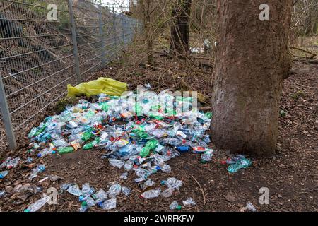 a large number of crushed plastic bottles lie in Hiroshima-Nagasaki Park, Cologne, Germany. eine groesse Anzahl zerdrueckter Plastikflaschen liegen im Stock Photo