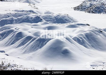 Pristine untouched snow on rolling hills Stock Photo
