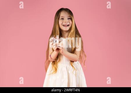 The best advertising concept for free time. Close-up portrait of confident, cute, charming, pretty, cute, gorgeous girl isolated on pink background wi Stock Photo