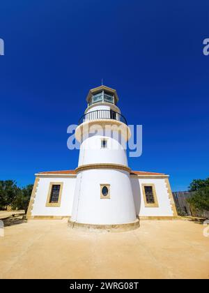 Gavdos Lighthouse, Crete island summer destination Greece. Under view of beacon monument summer sunny day. Operates as museum and cafe. Vertical Stock Photo