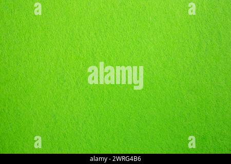 Felt fabric texture with visible fiber, toxic green color abstract pattern backdrop Stock Photo