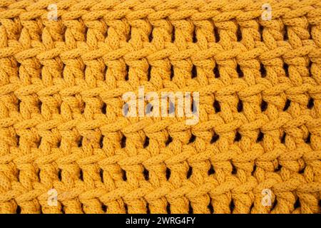 Orange cotton cord crochet pattern, abstract texture background, soft focus close up Stock Photo