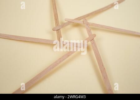 Bamboo wooden sticks demonstrating a reciprocal frame structure Stock Photo