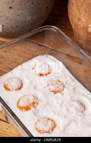 Salt-cured egg yolks are a concentrated burst of flavor and texture, made by curing egg yolks in salt.The cured yolks offer a delightful textural cont Stock Photo