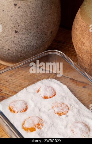 Salt-cured egg yolks are a concentrated burst of flavor and texture, made by curing egg yolks in salt.The cured yolks offer a delightful textural cont Stock Photo