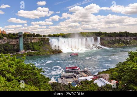 Hornblower Group tour boat filled with crowds throughout summer at Niagara Falls, Ontario, Canada. Stock Photo