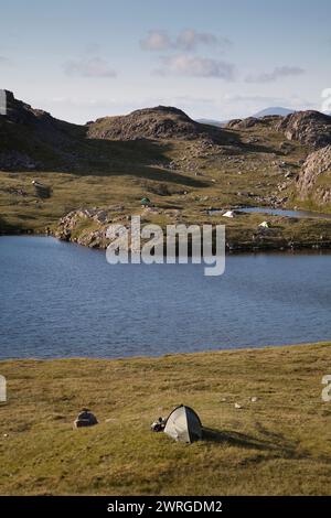 Wild camping at Sprinkling Tarn in the English Lake District Stock Photo