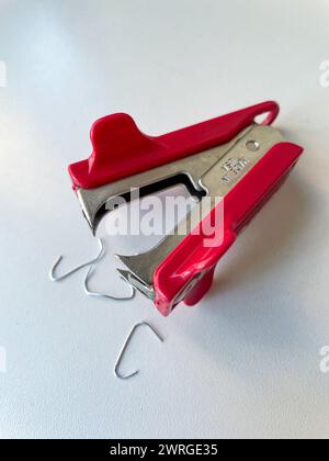 Still Life of Staple Remover and Used Staples, USA Stock Photo