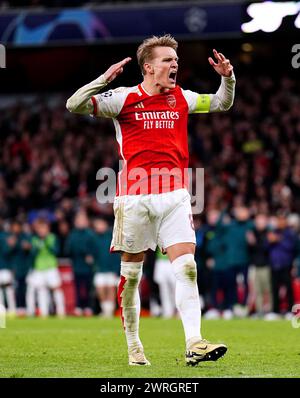 Arsenal's Martin Odegaard celebrates after scoring the first penalty of the penalty shoot-out during the UEFA Champions League Round of 16, second leg match at the Emirates Stadium, London. Picture date: Tuesday March 12, 2024. Stock Photo