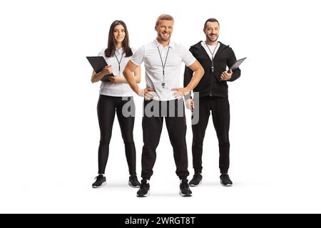 Male and female sport coaches posing in a group isolated on white background Stock Photo