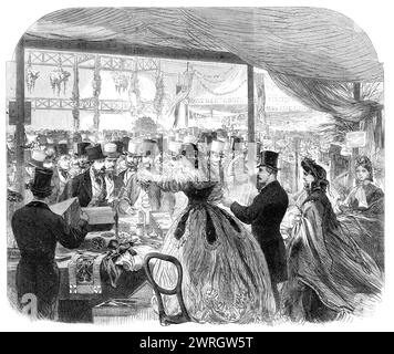The Royal Dramatic College Fete at the Crystal Palace, [London], 1864. Annual fund-raising festival. '...the central portion of the nave and transepts was filled with the stalls of a fancy fair, kept by many of the most popular of the London actresses, whose merry merchandise went off with remarkable success...On the left-hand side of the transept, looking towards the great orchestra, were the stalls of Miss Katharine Hickson; Miss Elsworthy, who was liberally patronised; Mrs. Stirling, who conducted her commercial operations with her usual spirit; and Mrs. St. Henry, who attracted a multitude Stock Photo