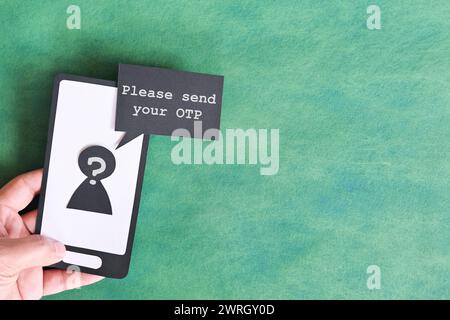 Send password text message smishing scam concept. Hand holding mobile phone with message from unknown sender. Stock Photo