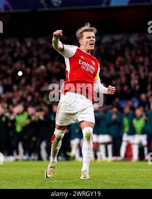 Arsenal's Martin Odegaard celebrates after scoring the first penalty of the penalty shoot-out during the UEFA Champions League Round of 16, second leg match at the Emirates Stadium, London. Picture date: Tuesday March 12, 2024. Stock Photo