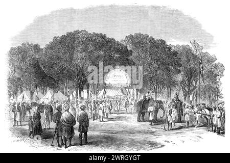 Agricultural Exhibition at Roorkee, North-West Provinces of India: general view, 1864. Engraving of a photograph by Mr. James Freeman, of '...the entrance to the showyard from the high road outside...There were some beautiful horses from every district of Upper India, various species of oxen and cows, a two-humped camel, some elks, and even a tiger cat, which could hardly be reckoned among the domestic animals. The show of sheep and poultry was not very good. In the department of machinery there were chaff-cutting machines, seed-crushers, and cotton-gins, a large hydraulic cotton-press, and se Stock Photo