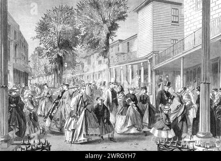 The promenade on the Pantiles, Tunbridge Wells, 1864. 'We present a view of that famous promenade at Tunbridge Wells called &quot;The Pantiles,&quot; from the materials with which it is paved. There is a story that this pavement was laid down early in the last century for the express satisfaction of Queen Anne, who was one of the earliest patronesses of Tunbridge Wells, and who had complained of the rough walking in its streets. This pleasant and healthy resort of fashionable Londoners in quest of mild recreation is a place of much historical and literary interest, being full of associations w Stock Photo