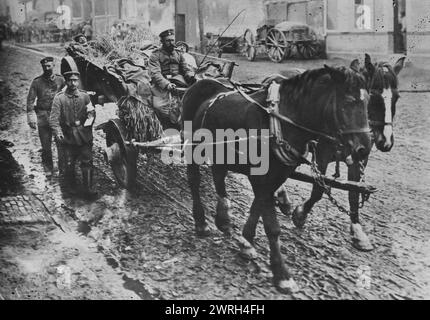Wounded Russian prisoners, between c1915 and c1918. Wounded Russian prisoners being carried in a horse-drawn cart through a street during World War I. Stock Photo
