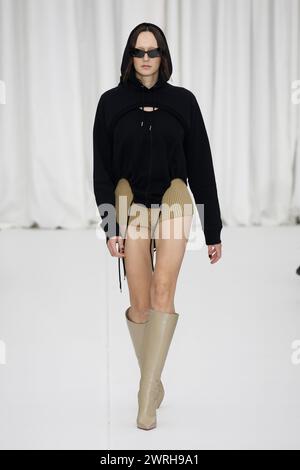 Paris, France. 27th Feb, 2024. A model walks on the runway at the Ester Manas fashion show during the Fall Winter 2024 Collections Fashion Show at Paris Fashion Week in Paris on February 27 2024. (Photo by Jonas Gustavsson/Sipa USA) Credit: Sipa USA/Alamy Live News Stock Photo