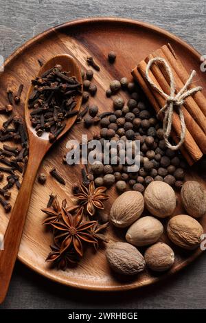 Different spices and nuts on gray table, top view Stock Photo