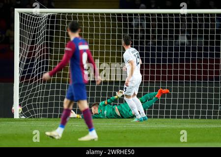Barcelona, Spain. 12th Mar, 2024. Amir Rrahmani (SSC Napoli) scores during the Champions League football match between FC Barcelona and SSC Napoli, at the Estadi Lluis Companys stadium in Barcelona, Spain, on March 12, 2024. Foto: Siu Wu Credit: dpa/Alamy Live News Stock Photo