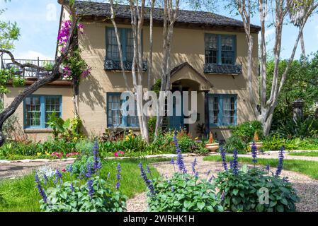 Two-story house with floral landscaping, in the historic district in McAllen, Hidalgo County, Texas, USA. Stock Photo