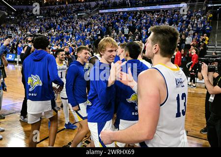 South Dakota State Jackrabbits forward Luke Appel (13) celebrates with teammates after winning the men's final at the Summit League basketball tournament between the Denver Pioneers and the South Dakota State Jackrabbits at the Denny Sanford Premier Center in Sioux Falls, South Dakota on Tuesday, March 12, 2024. South Dakota State defeated Denver 76-68.Russell Hons/CSM. Stock Photo