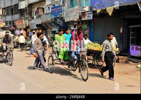 Varanasi Rickshaws Two cycle rickshaws in Varanasi with passengers. Slow shutter speed and ...