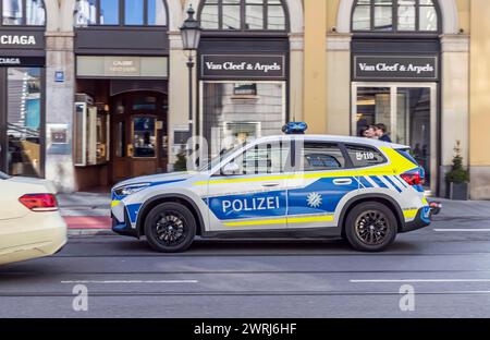 Bavarian police car of the brand BMW with flashing blue lights during ...
