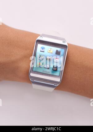 Wrist, smart watch and icons technology or screen for schedule planning on white background, location or studio. Person, arm and display network Stock Photo