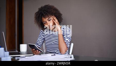 Woman, finance and thinking of stress at home, table with documents for tax and calculating debt. African female person, bills and vision of online Stock Photo