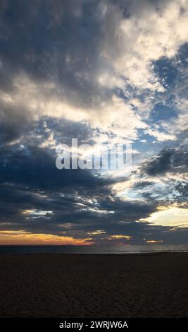 A A sunset with sun rays on the beach, mystical scene with space for text Stock Photo