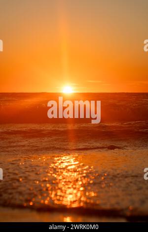 A A sunset with sun rays on the beach, mystical scene with space for text Stock Photo