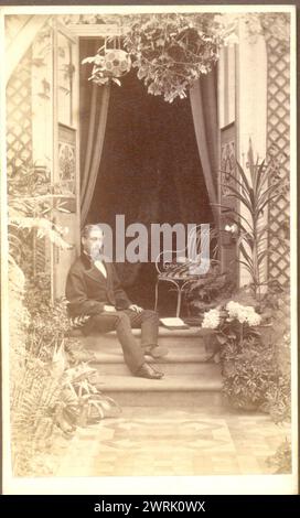 Victorian carte de visite portrait of man relaxing on his doorstep circa 1883 (as shown in 1881 catalogue ref:  ID  2X0D81X) Stock Photo