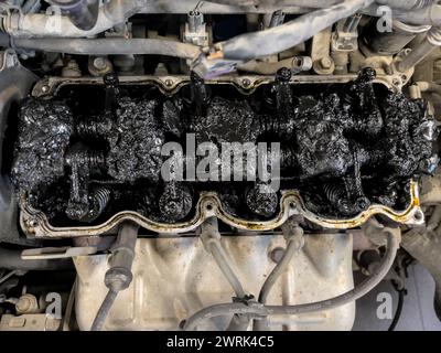 Car Engine Rag Car engine caked with residues and tar, a symbol of poor maintenance ...