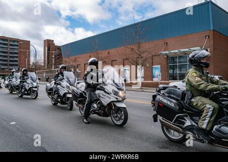 Washington State Patrol officers on motorcycles lead a solemn ...