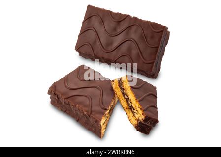 Snack sponge cake filled and covered with chocolate, Whole chocolate snack and one cut isolated on white with clipping path included Stock Photo