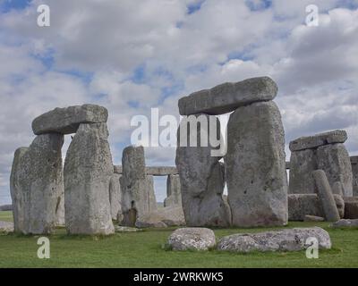 the megalithic standing stones, now a major tourist attraction, of Stonehenge, Wiltshire under a cloudy sky Stock Photo