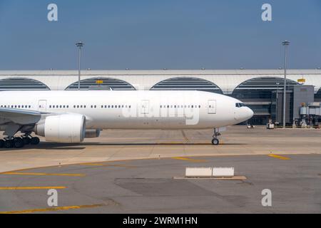 Taxiing commercial airliner nose engine portholes, ready for departure background terminal. Stock Photo