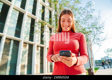 Big group of young adult real people smiling and having fun outdoors at vacations. Portrait of happy friends laughing. University teenage students on Stock Photo