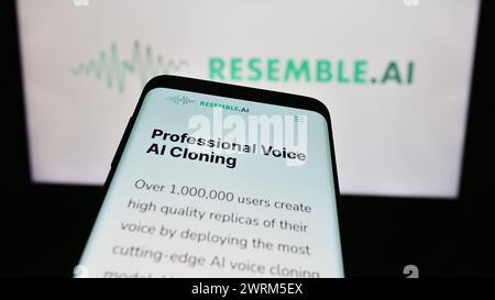 Mobile phone with webpage of Canadian artificial intelligence company Resemble AI in front of business logo. Focus on top-left of phone display. Stock Photo