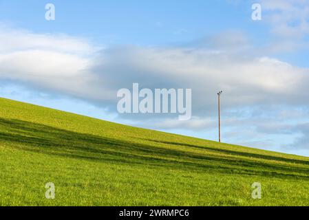 33kv 3 phase overhead cables on a hillside in the Somerset countryside, England. Stock Photo