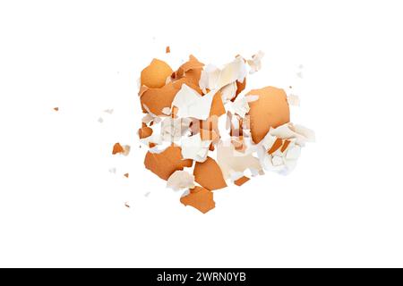 Pile of broken eggshell isolated on white background. Top view flat lay food waste Stock Photo