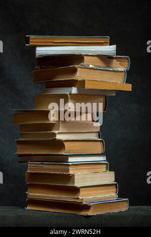 A stack of old books and notebooks on the table Stock Photo