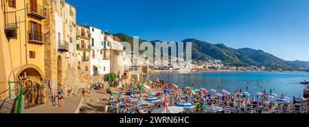 Panoramic view of tourists on beach, mountains in background, Cefalu, Province of Palermo, Sicily, Italy, Mediterranean, Europe Copyright: JohnxGuidi Stock Photo