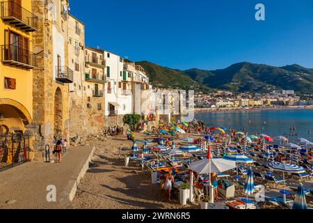 Tourists on beach, Cefalu, mountains in background, Province of Palermo, Sicily, Italy, Mediterranean, Europe Copyright: JohnxGuidi 1237-650 Stock Photo